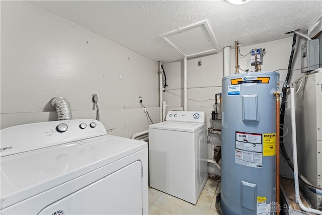416 Bent Twig Dr, Vandalia, OH 45377 - washroom featuring electric water heater, washing machine and dryer, a textured ceiling, and light tile patterned flooring