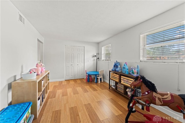416 Bent Twig Dr, Vandalia, OH 45377 - living area featuring light wood finished floors and baseboards
