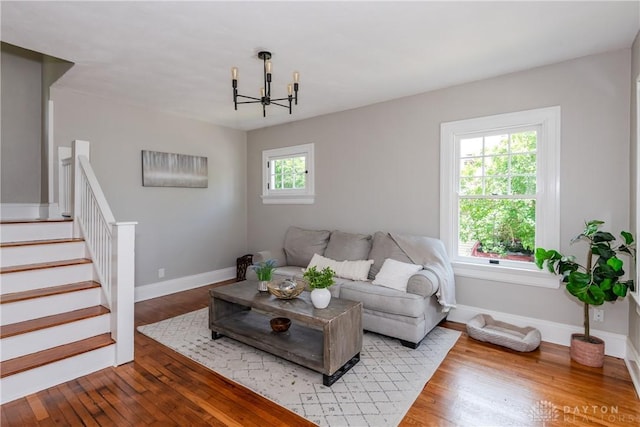331 Illinois Ave, Dayton, OH 45410 - living room with a chandelier, wood finished floors, and stairs