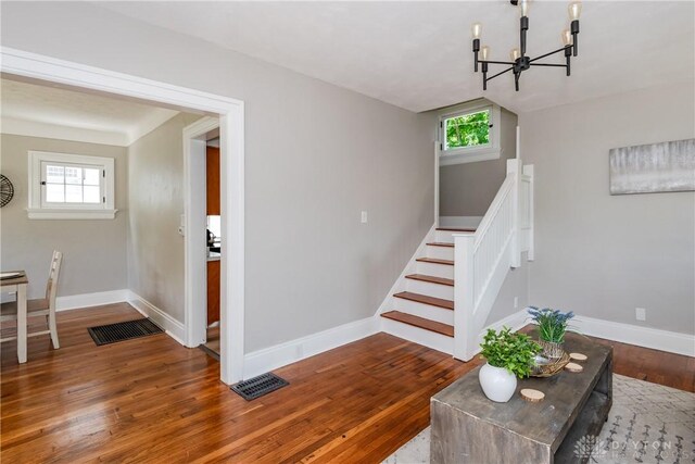 331 Illinois Ave, Dayton, OH 45410 - staircase featuring a chandelier, plenty of natural light, and wood finished floors