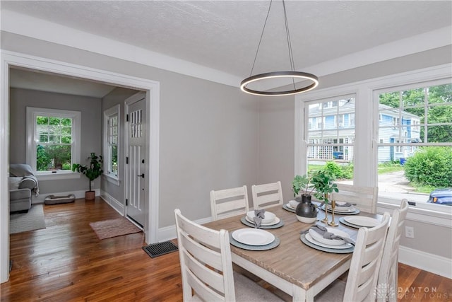 331 Illinois Ave, Dayton, OH 45410 - dining space featuring healthy amount of natural light, dark wood-style flooring, a chandelier, and a textured ceiling