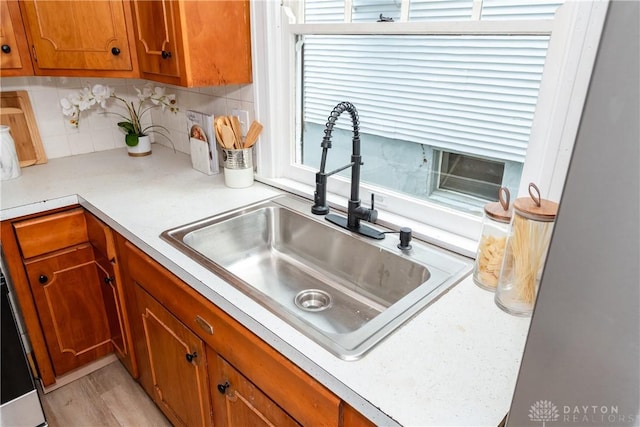 331 Illinois Ave, Dayton, OH 45410 - kitchen with brown cabinetry, backsplash, and light countertops