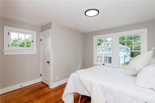 331 Illinois Ave, Dayton, OH 45410 - bedroom with wood finished floors and a textured ceiling