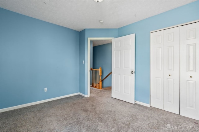 110 Easton Manor Dr, Monroe, OH 45050 - unfurnished bedroom with carpet floors, a closet, and a textured ceiling