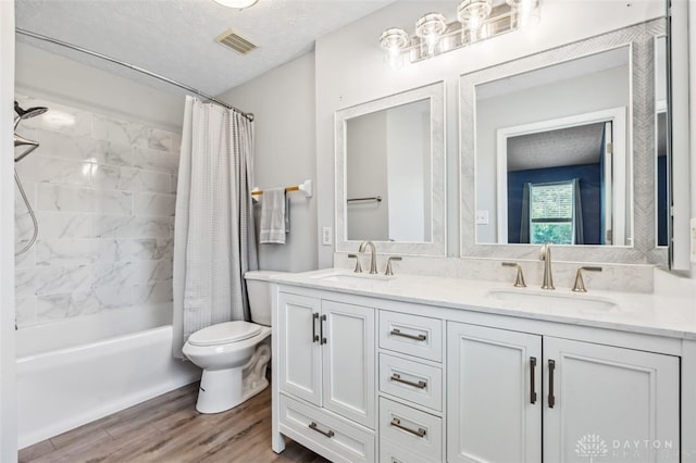 110 Easton Manor Dr, Monroe, OH 45050 - full bathroom featuring wood finished floors, double vanity, and shower / bath combination with curtain