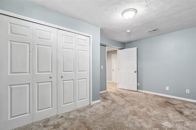 110 Easton Manor Dr, Monroe, OH 45050 - unfurnished bedroom featuring carpet floors, a closet, and a textured ceiling