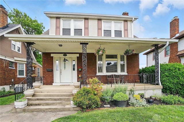 2344 Quatman Ave, Norwood, OH 45212 - american foursquare style home featuring a porch and brick siding