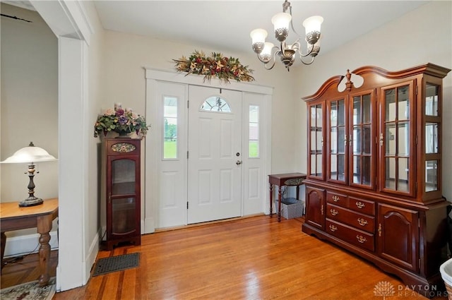 2344 Quatman Ave, Norwood, OH 45212 - foyer with a chandelier and light wood finished floors