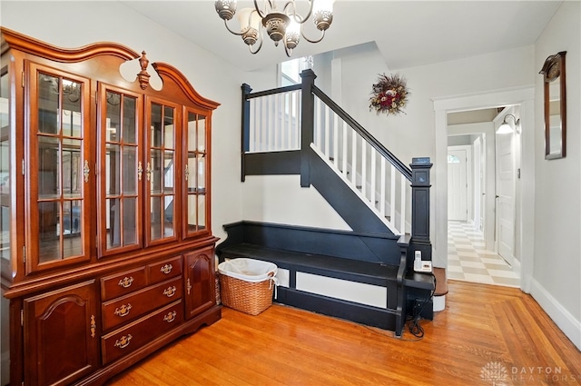 2344 Quatman Ave, Norwood, OH 45212 - stairs with a chandelier and wood finished floors