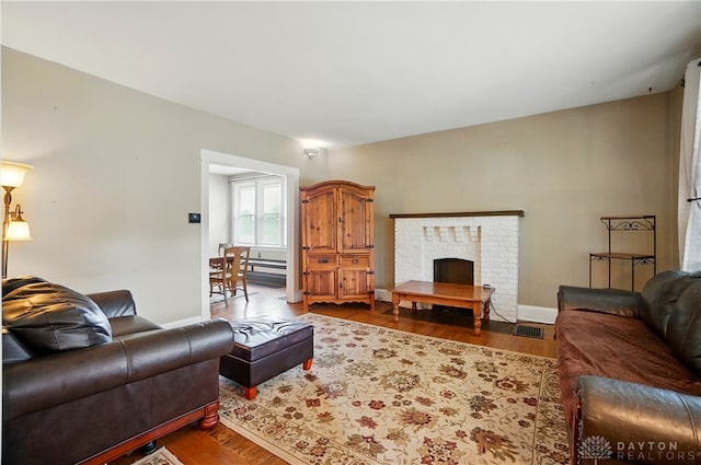 2344 Quatman Ave, Norwood, OH 45212 - living room with wood finished floors and a fireplace
