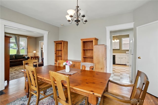 2344 Quatman Ave, Norwood, OH 45212 - dining room featuring a chandelier and light wood-style floors