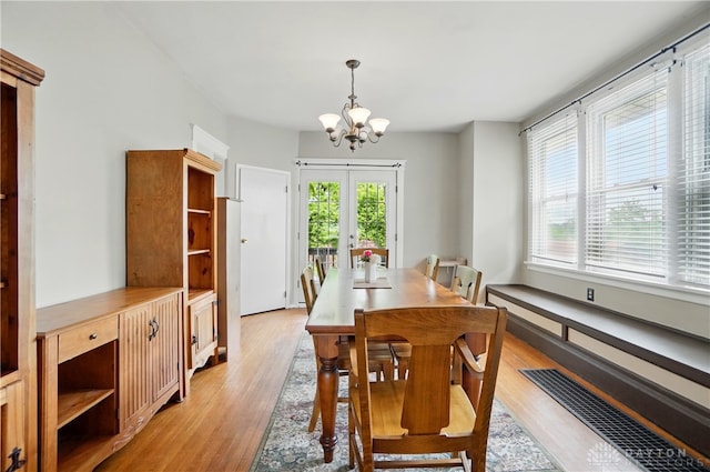 2344 Quatman Ave, Norwood, OH 45212 - dining space featuring a chandelier, light wood finished floors, and french doors