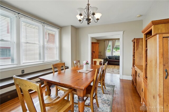 2344 Quatman Ave, Norwood, OH 45212 - dining space with light wood-style floors and a chandelier