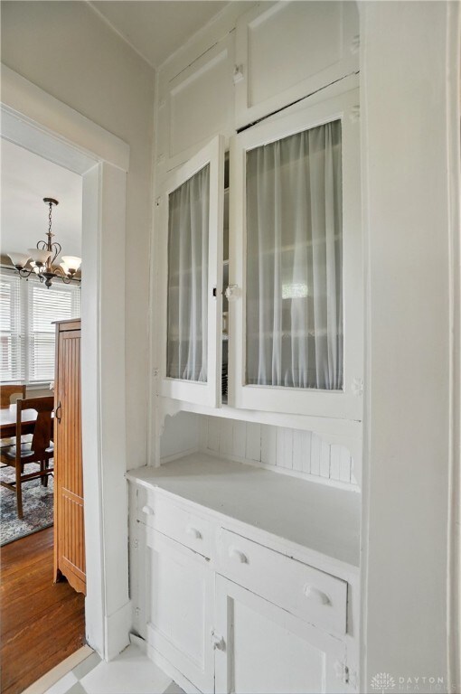 2344 Quatman Ave, Norwood, OH 45212 - bar featuring a chandelier and wood finished floors