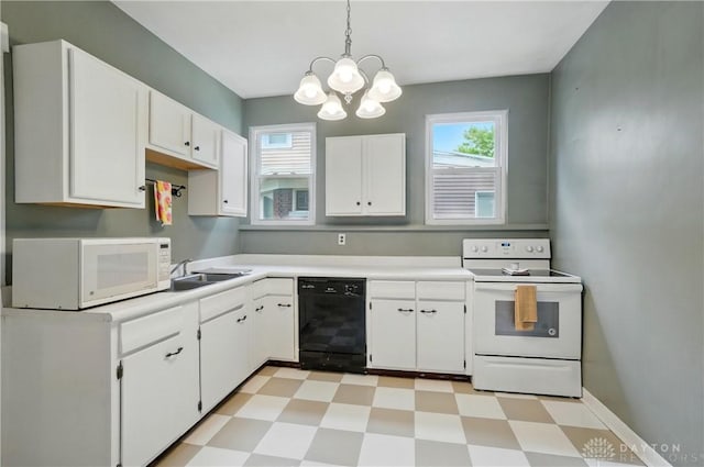 2344 Quatman Ave, Norwood, OH 45212 - kitchen featuring white appliances, light floors, a chandelier, and white cabinetry