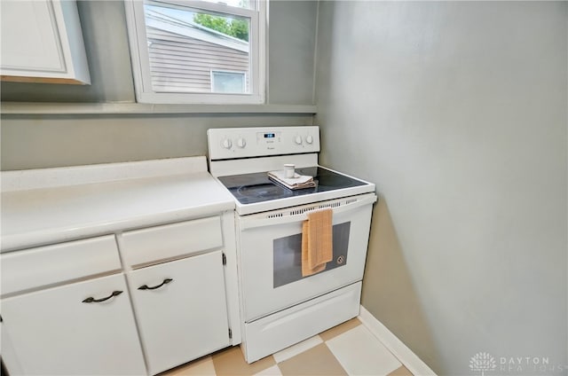 2344 Quatman Ave, Norwood, OH 45212 - kitchen featuring electric range, light countertops, and white cabinets