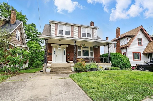 2344 Quatman Ave, Norwood, OH 45212 - view of front facade featuring covered porch, brick siding, a front lawn, and a chimney