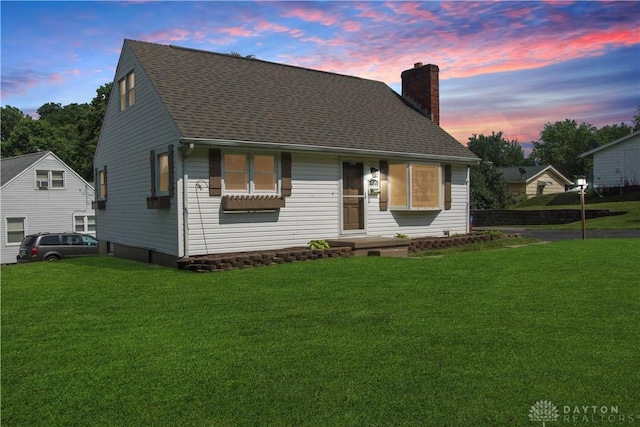 400 S Hayden Ave, Riverside, OH 45431 - view of front facade featuring a chimney, a lawn, and roof with shingles