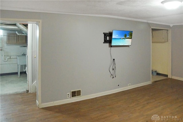 400 S Hayden Ave, Riverside, OH 45431 - unfurnished living room featuring crown molding and wood finished floors