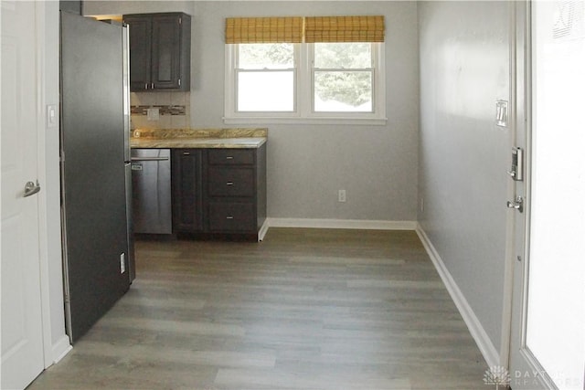 400 S Hayden Ave, Riverside, OH 45431 - kitchen featuring appliances with stainless steel finishes, wood finished floors, dark brown cabinetry, and light countertops