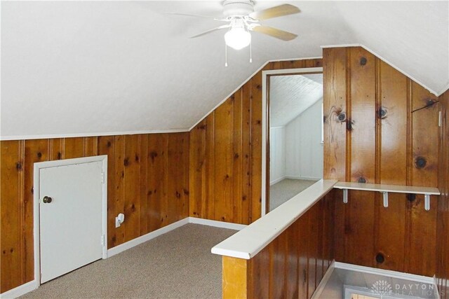 400 S Hayden Ave, Riverside, OH 45431 - additional living space featuring lofted ceiling, wood walls, a ceiling fan, and carpet