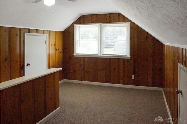 400 S Hayden Ave, Riverside, OH 45431 - additional living space with lofted ceiling, wood walls, a ceiling fan, and carpet floors