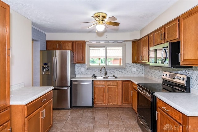 4155 Eckworth, Bellbrook, OH 45305 - kitchen with stainless steel appliances, ceiling fan, backsplash, and brown cabinets