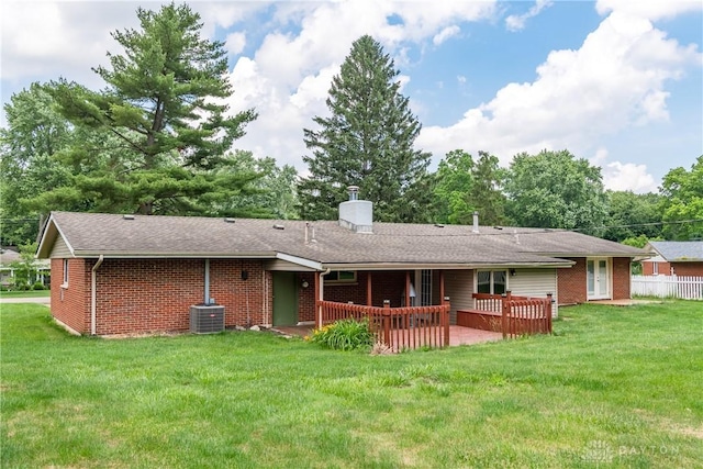 4155 Eckworth, Bellbrook, OH 45305 - back of house with brick siding, a chimney, a lawn, and a shingled roof