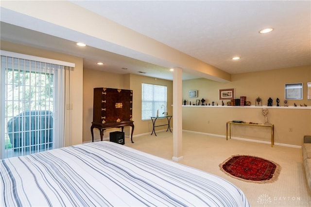 3917 E Summit Ridge Dr, Beavercreek, OH 45430 - bedroom with carpet floors, recessed lighting, multiple windows, and access to exterior