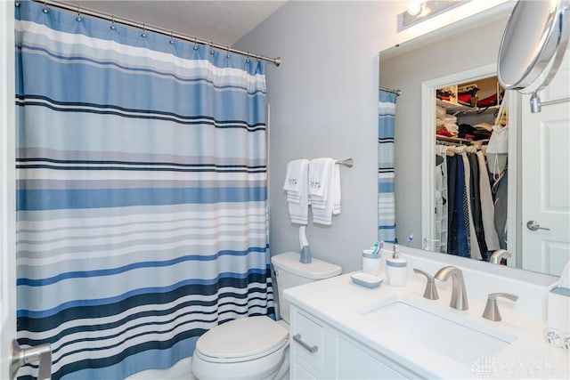 3917 E Summit Ridge Dr, Beavercreek, OH 45430 - bathroom with vanity, curtained shower, and a spacious closet