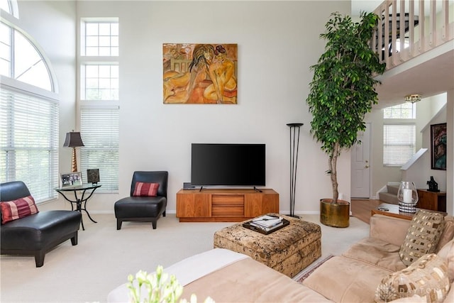 3917 E Summit Ridge Dr, Beavercreek, OH 45430 - carpeted living room with baseboards and a high ceiling