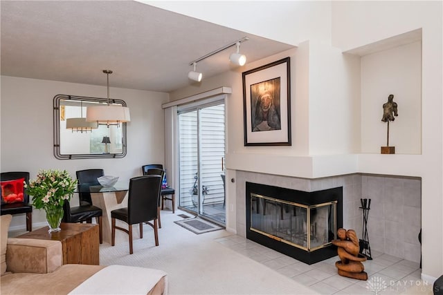 3917 E Summit Ridge Dr, Beavercreek, OH 45430 - dining space featuring track lighting, a fireplace, and carpet floors