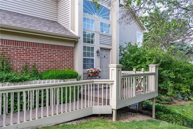 3917 E Summit Ridge Dr, Beavercreek, OH 45430 - entrance to property with a wooden deck, brick siding, and a shingled roof