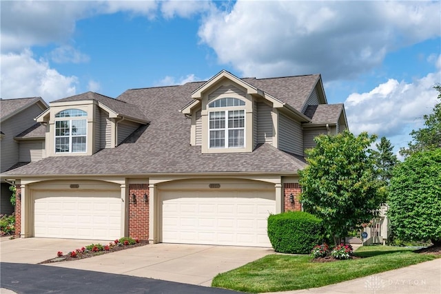 3917 E Summit Ridge Dr, Beavercreek, OH 45430 - view of front of home featuring brick siding, roof with shingles, and driveway