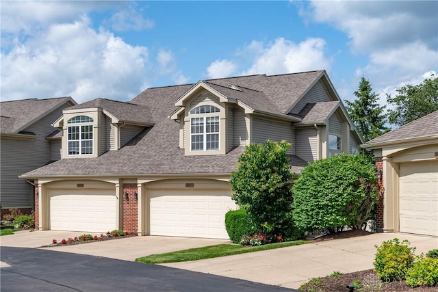 3917 E Summit Ridge Dr, Beavercreek, OH 45430 - view of front of house featuring roof with shingles and driveway