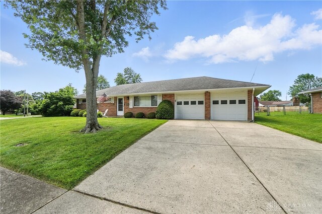 903 Meadow Ln, Lebanon, OH 45036 - ranch-style home featuring a garage, brick siding, and driveway