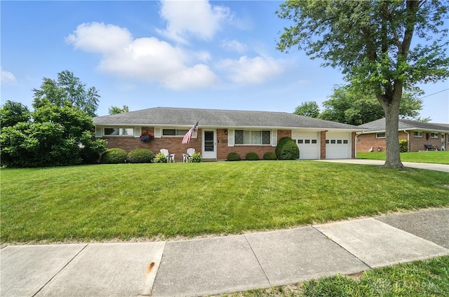 903 Meadow Ln, Lebanon, OH 45036 - single story home with a garage, brick siding, a front lawn, and driveway