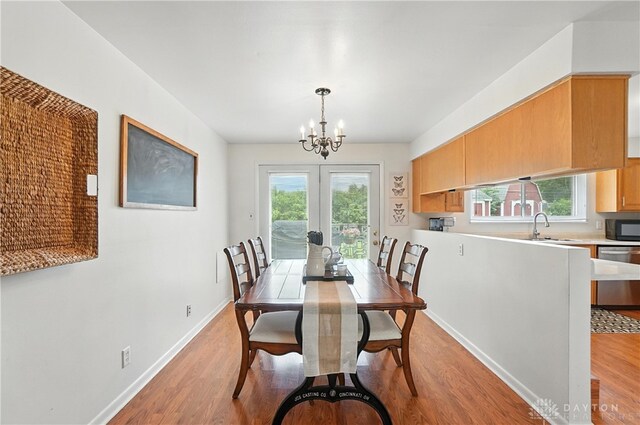 903 Meadow Ln, Lebanon, OH 45036 - dining area featuring light wood-style flooring and a chandelier