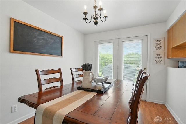 903 Meadow Ln, Lebanon, OH 45036 - dining area with a chandelier and light wood-style flooring