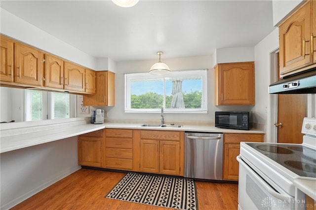 903 Meadow Ln, Lebanon, OH 45036 - kitchen featuring stainless steel dishwasher, white electric range oven, black microwave, light wood-type flooring, and light countertops