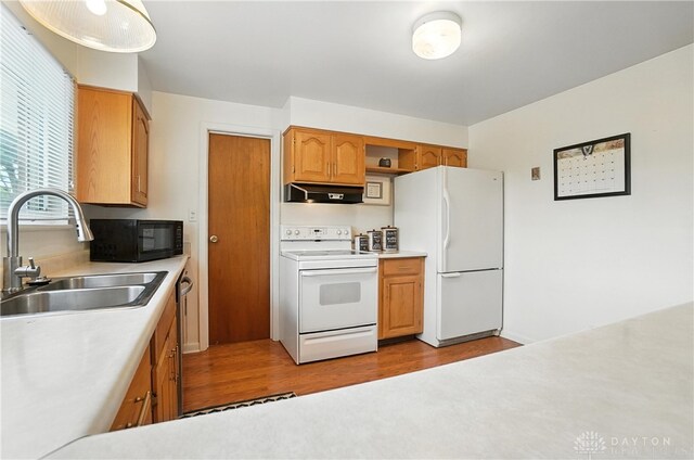 903 Meadow Ln, Lebanon, OH 45036 - kitchen featuring white appliances, extractor fan, wood finished floors, and light countertops