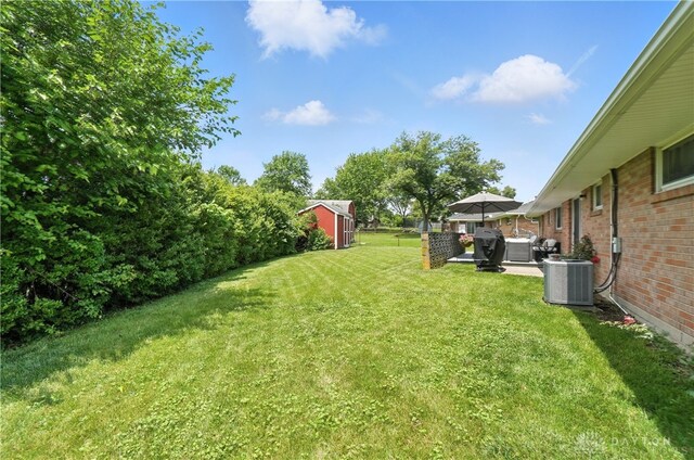 903 Meadow Ln, Lebanon, OH 45036 - view of grassy yard featuring a storage unit