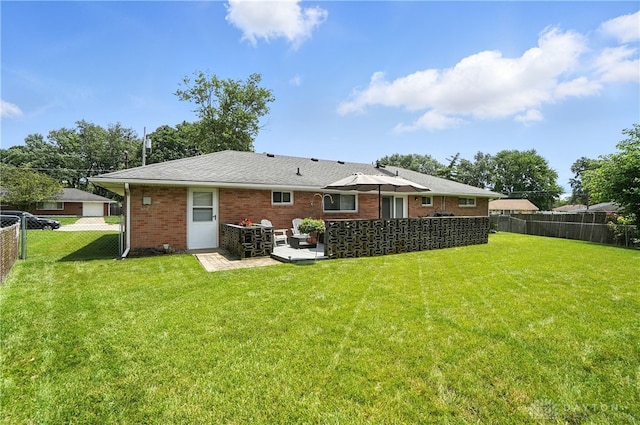 903 Meadow Ln, Lebanon, OH 45036 - rear view of house with a fenced backyard, brick siding, and a patio