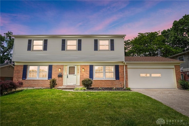1023 Hilliard Dr, Delhi Twp, OH 45238 - colonial inspired home featuring concrete driveway, brick siding, a garage, and a lawn