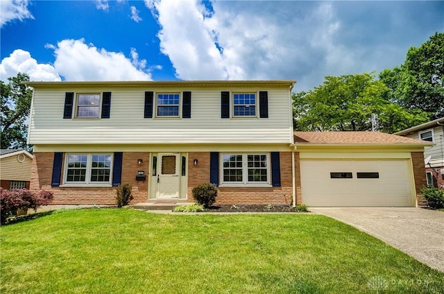 1023 Hilliard Dr, Delhi Twp, OH 45238 - colonial house featuring brick siding, a garage, concrete driveway, and a front yard