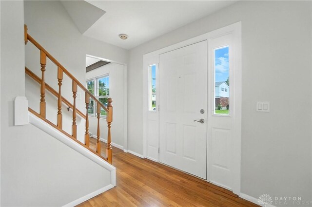 1023 Hilliard Dr, Delhi Twp, OH 45238 - foyer featuring wood finished floors and stairs