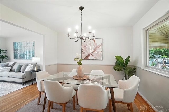 1023 Hilliard Dr, Delhi Twp, OH 45238 - dining space featuring a chandelier and wood finished floors