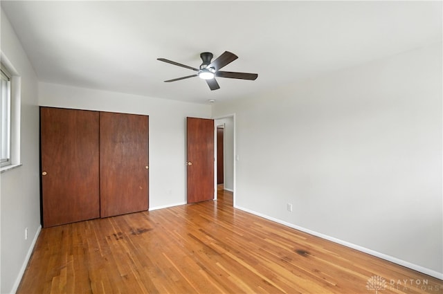 1023 Hilliard Dr, Delhi Twp, OH 45238 - unfurnished bedroom with light wood-type flooring, a closet, and a ceiling fan