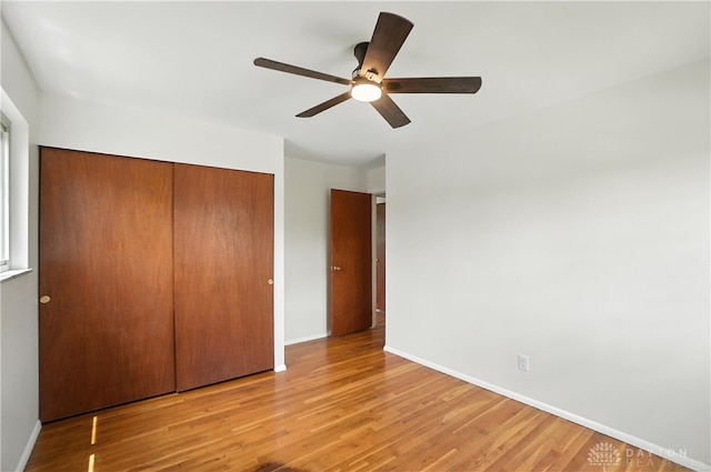 1023 Hilliard Dr, Delhi Twp, OH 45238 - unfurnished bedroom featuring a closet, light wood finished floors, and a ceiling fan