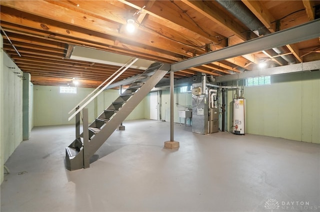 1023 Hilliard Dr, Delhi Twp, OH 45238 - below grade area with gas water heater, stairs, and heating unit